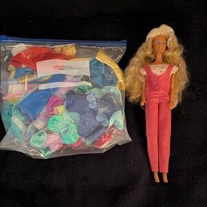Doll with Pink Jumpsuit and Clothing Accessories